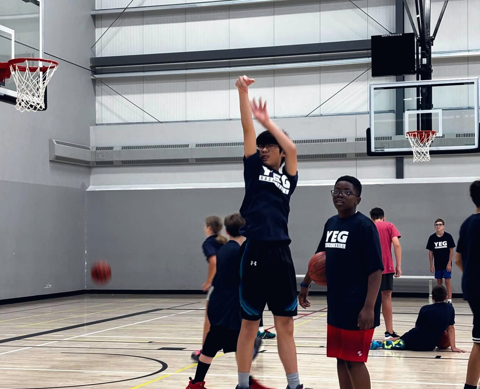 A full summer camp group in YEG BASKETBALL shirts