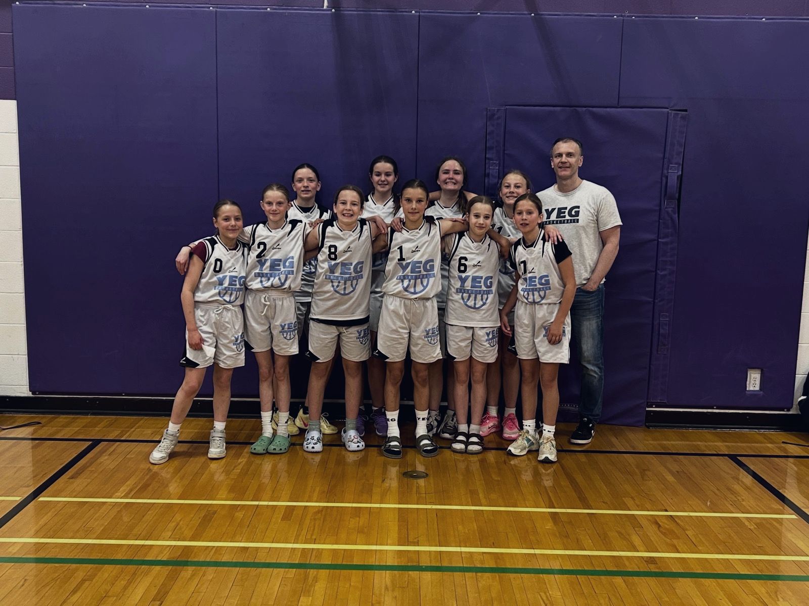 Girls team with their coach in Cardston